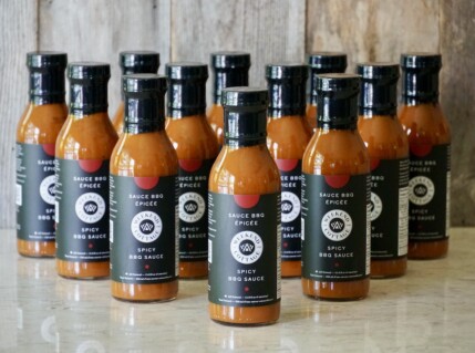 A 12-bottle case of Weekend at the Cottage Spicy BBQ Sauce.