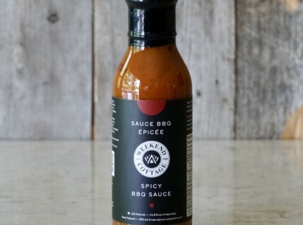 A bottle of Weekend at the Cottage Spicy BBQ Sauce.