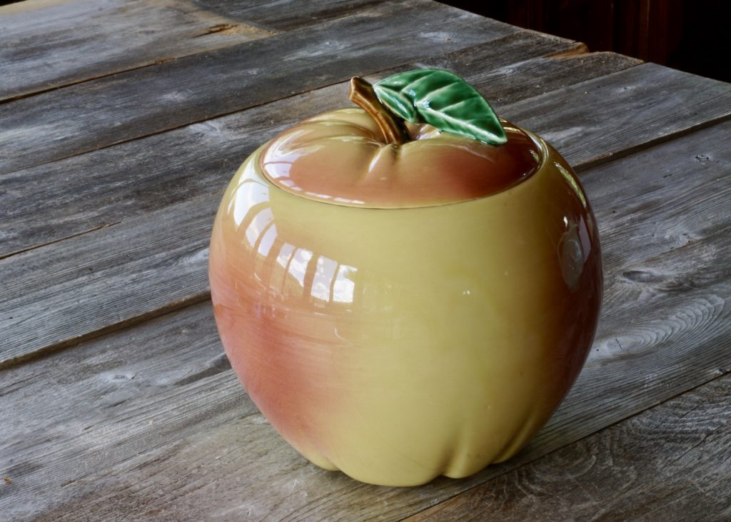 A classic McCoy cookie jar hand painted and in the shape of a ripened peach.
