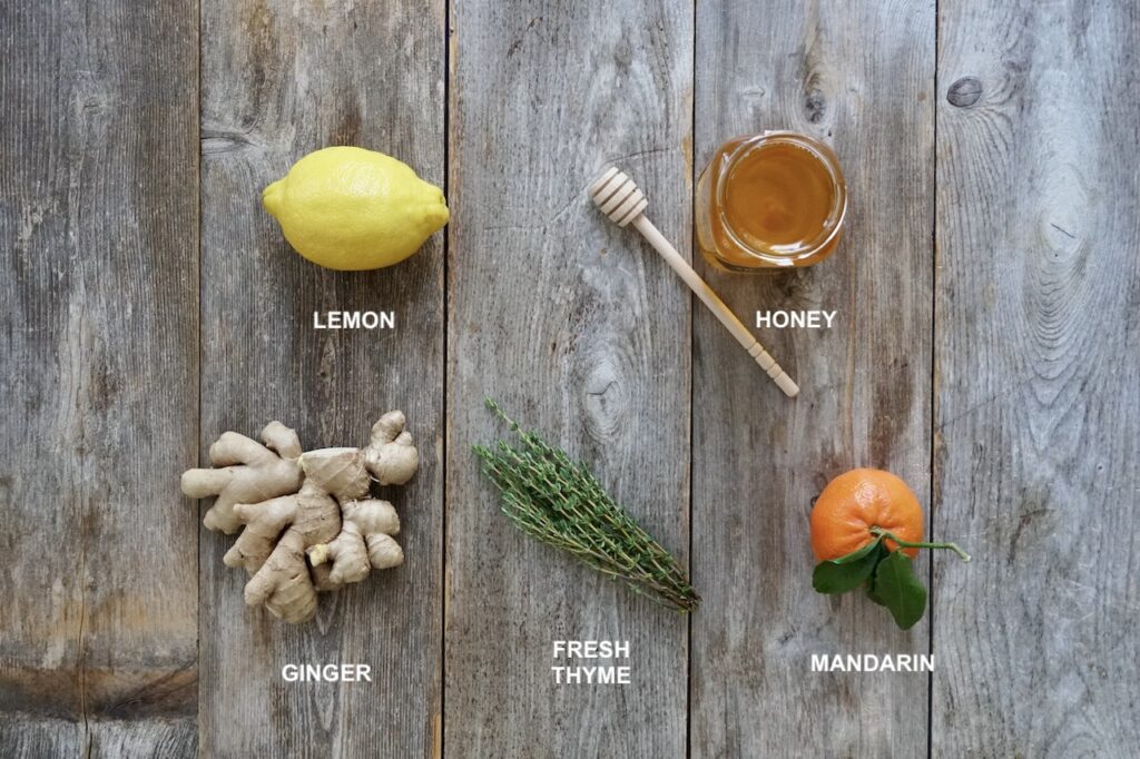 Ingredients needed to make a cold remedy of ginger tea with lemon and honey.