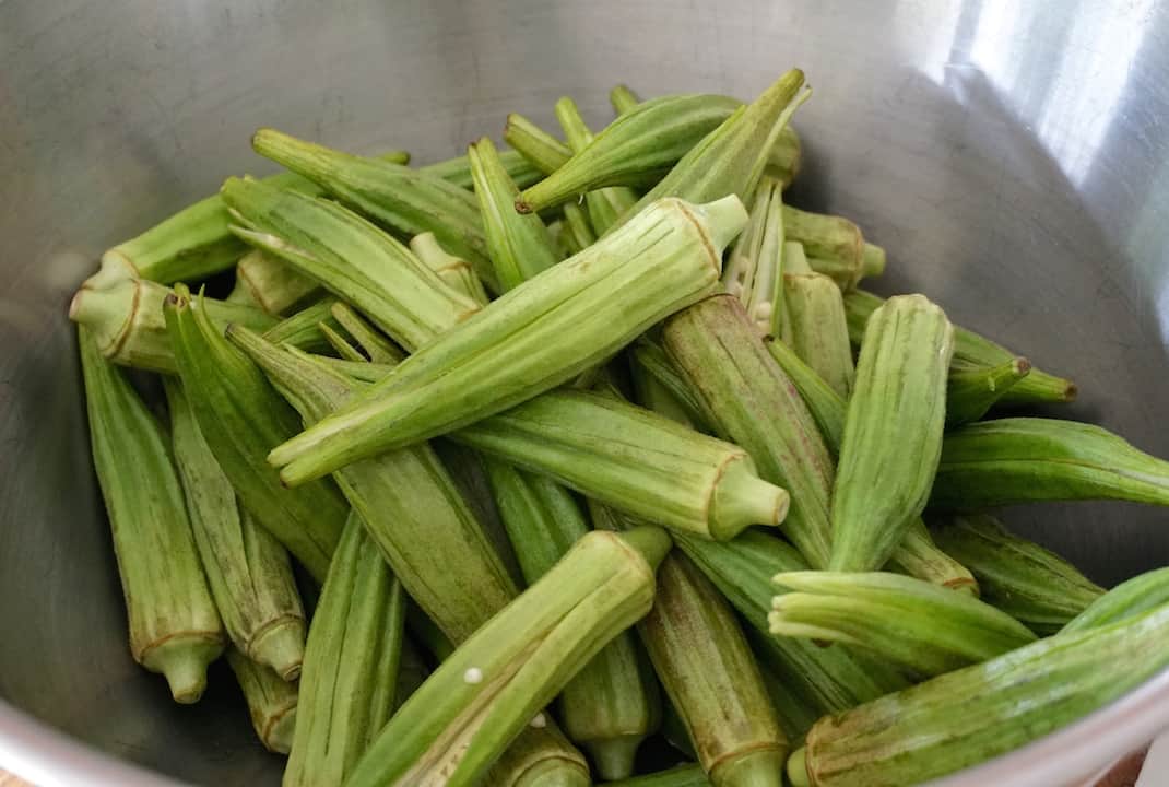 Fresh okra washed, dried then split down the middle