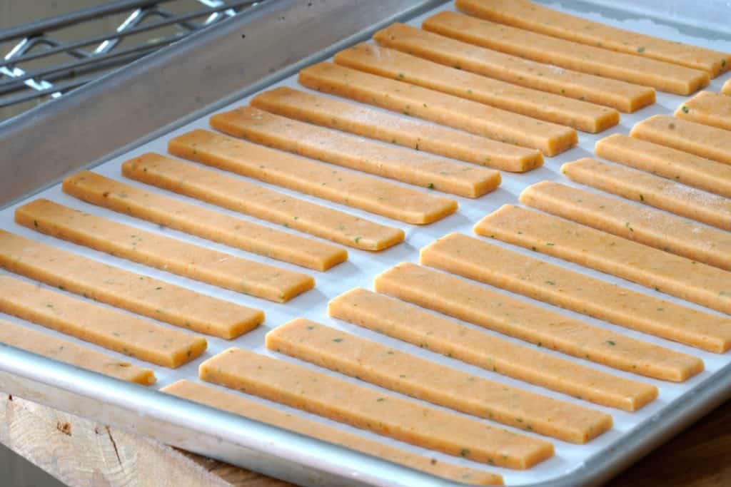 Cheese sticks on a baking sheet