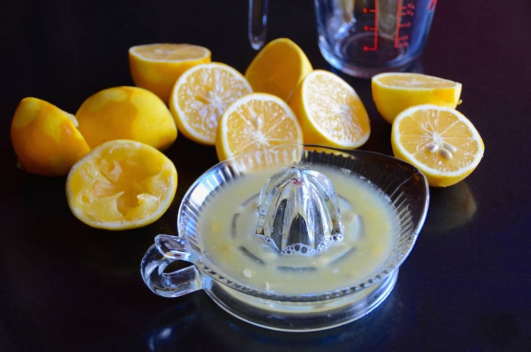 Meyer lemons being juiced for the recipe