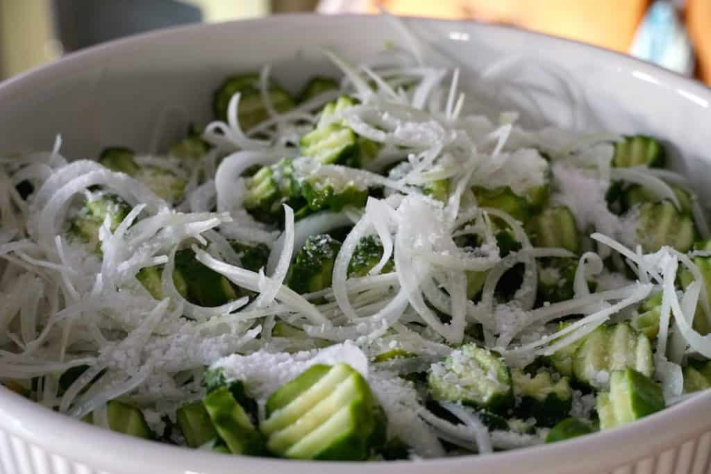 Cucumber tossed with shaved onion and pickling salt