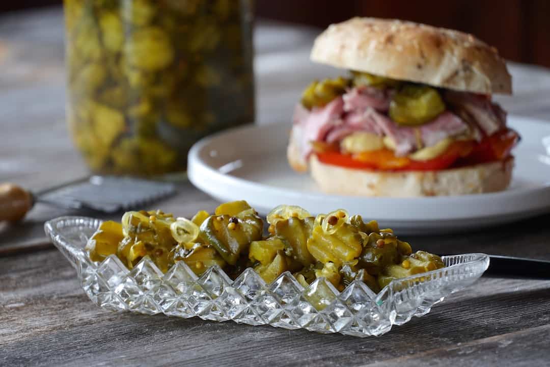 Our famous bread and butter pickles served next to a favourite sandwich