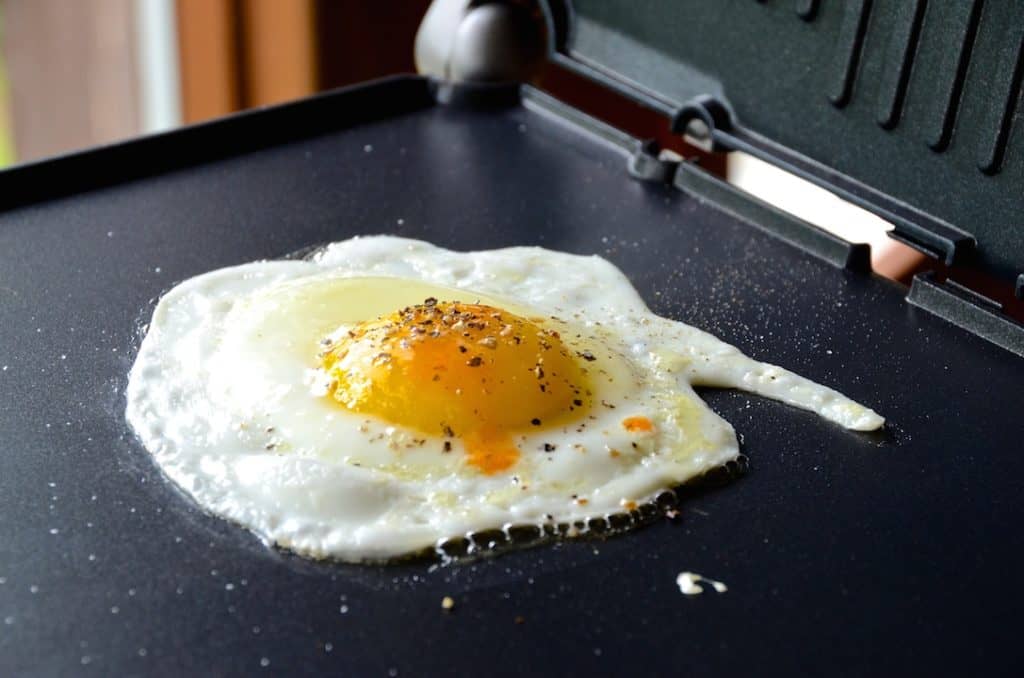 A fried egg with a splash of tabasco