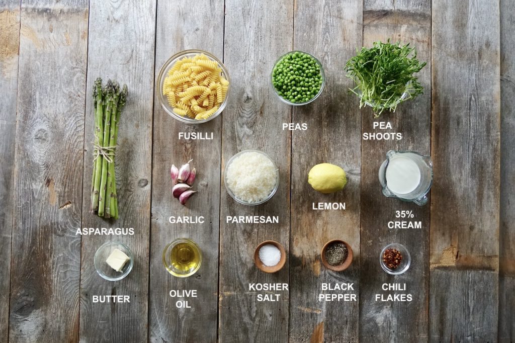Ingredients for a fresh Pasta Primavera with Asparagus include: asparagus, peas, pasta, cheese, cream, lemon, seasoning.