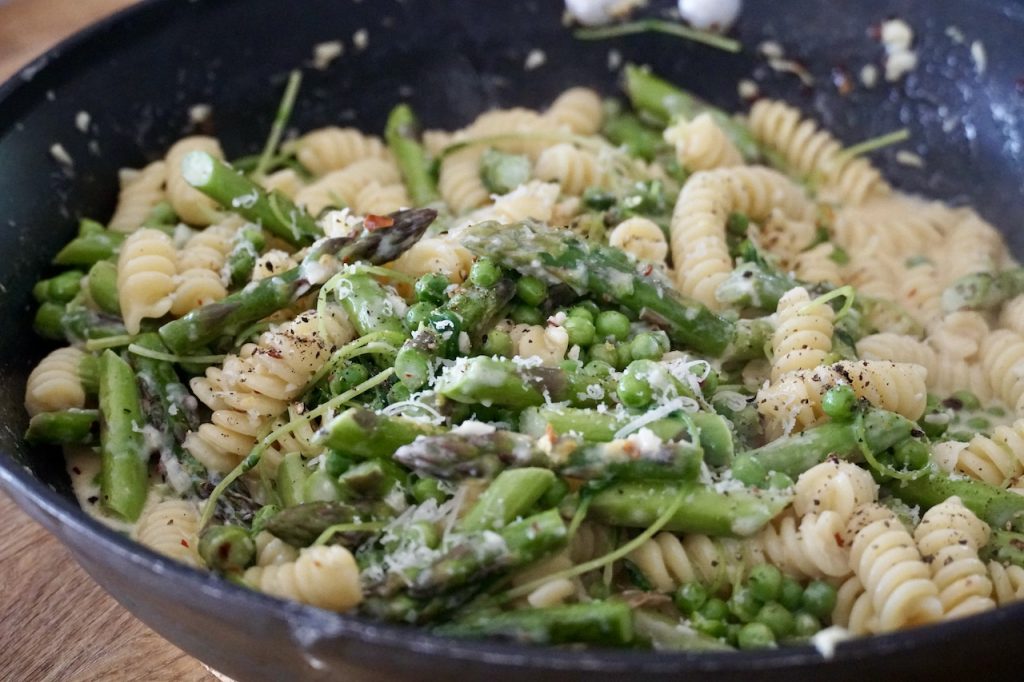 A close up of the pasta primavera cooked up in a large skillet.