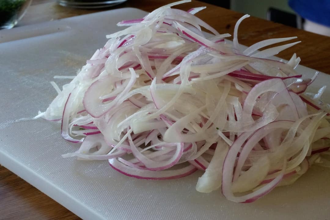 Red onions thinly shaved