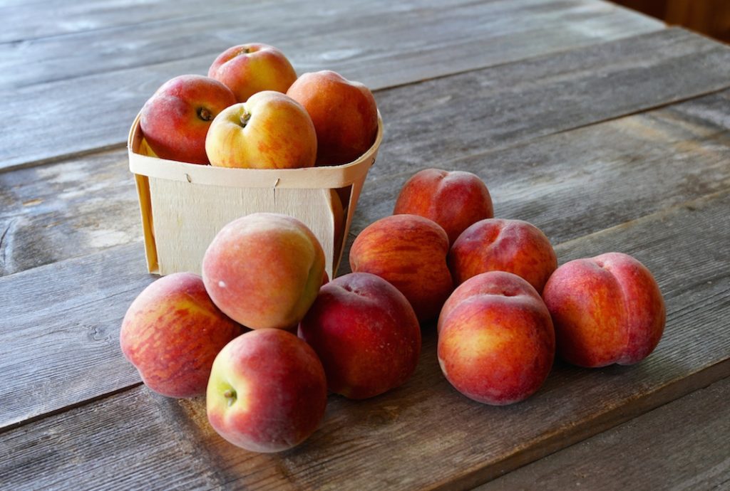 A basket of fresh peaches