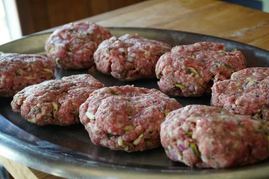 Perfectly shaped homemade lamb burgers ready for the grill