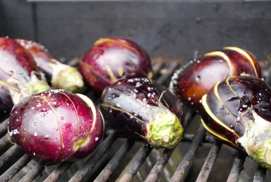 Baby eggplants scored and on the grill