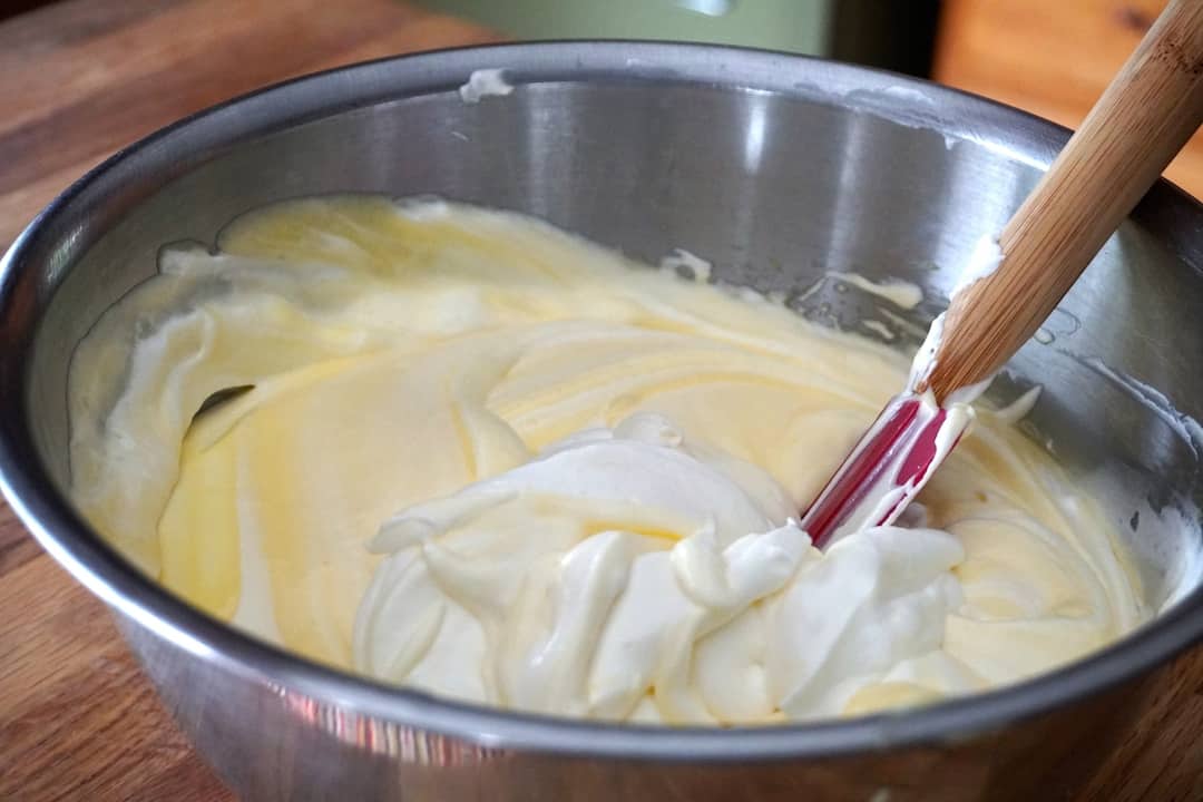 Billowy custard ready to be spread over the layers of biscuits