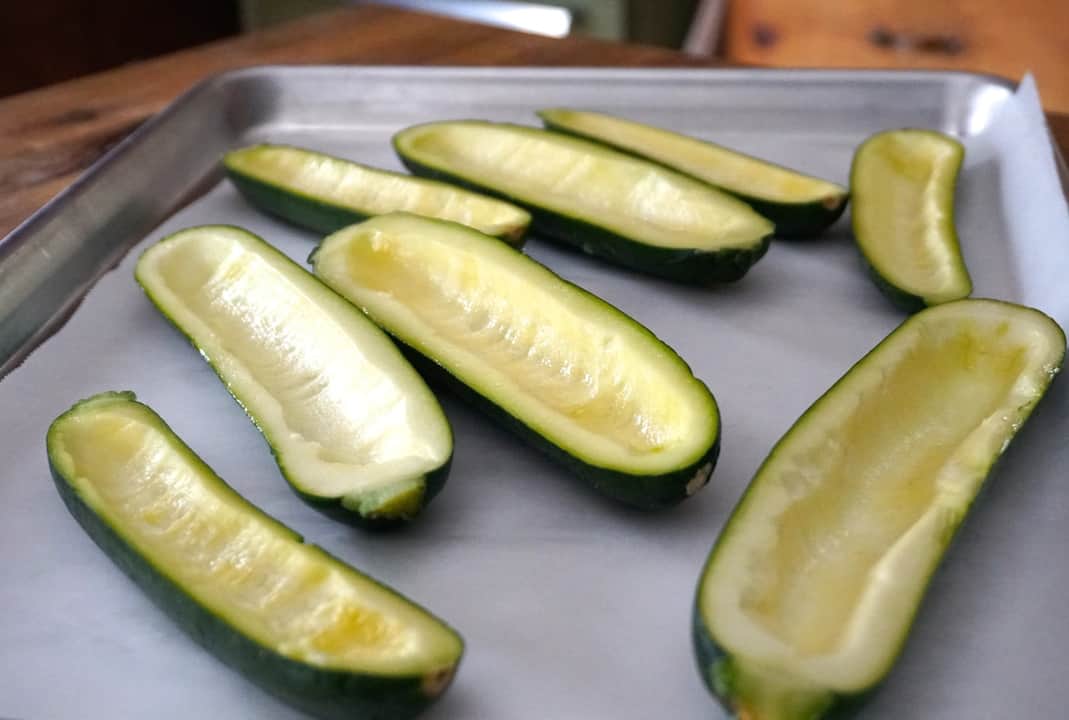 Zucchinis halved with the flesh scooped out