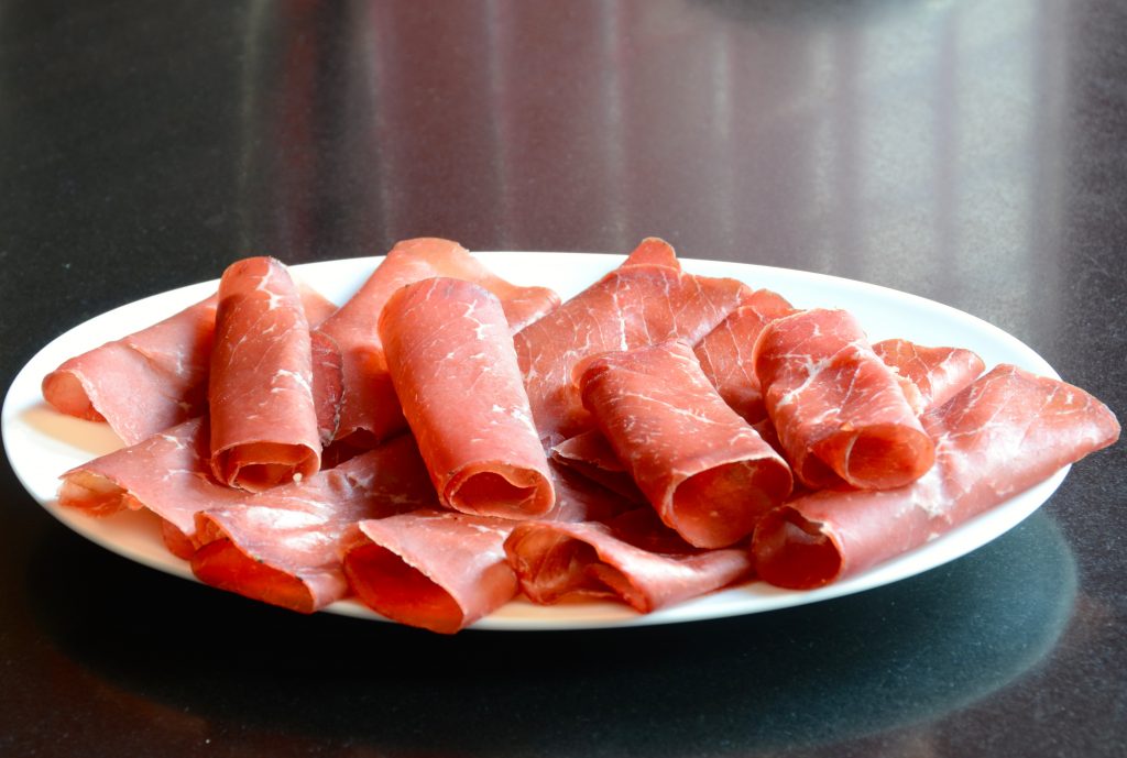Thinly sliced cured beef