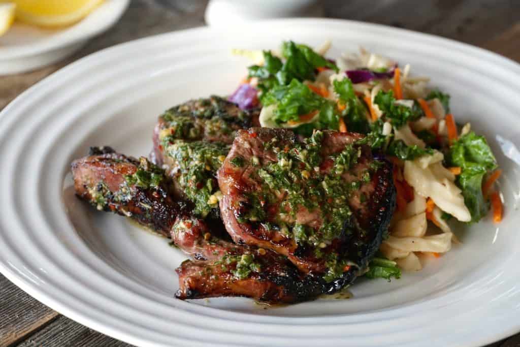 Grilled Lamb Loin Chops served on a plate with salad