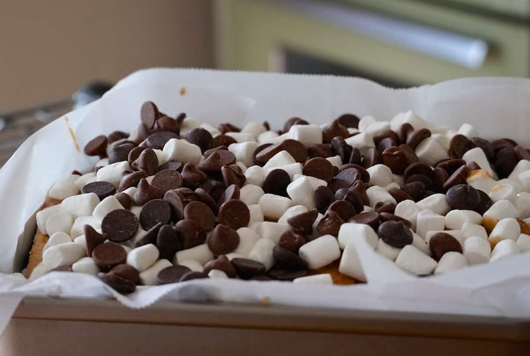 The pan filled with marshmallows and chocolate