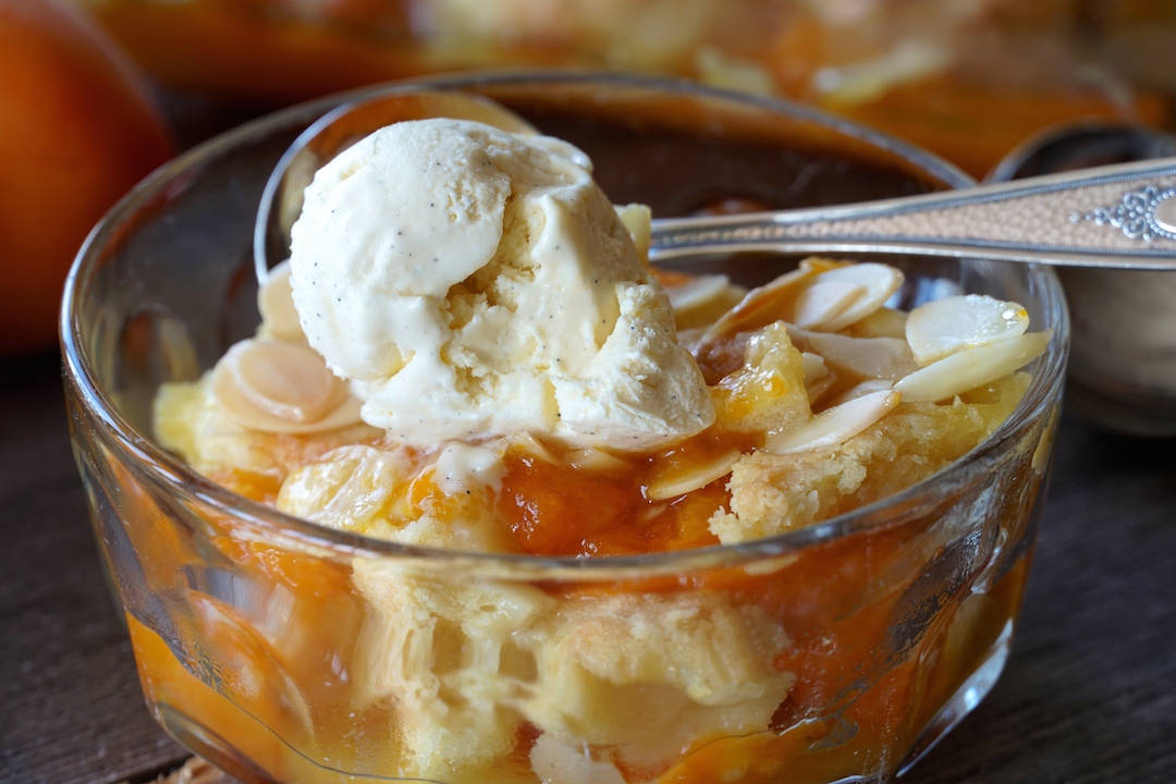 Scrumptious Apricot Cobbler served with homemade vanilla ice cream