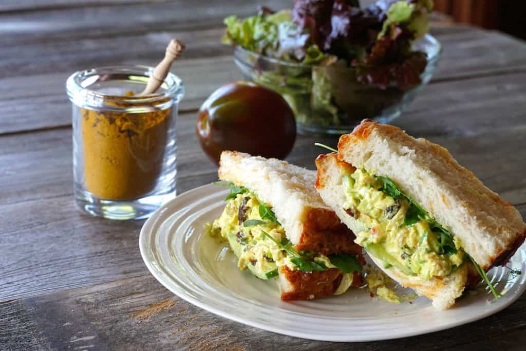 A sandwich made with curry chicken salad