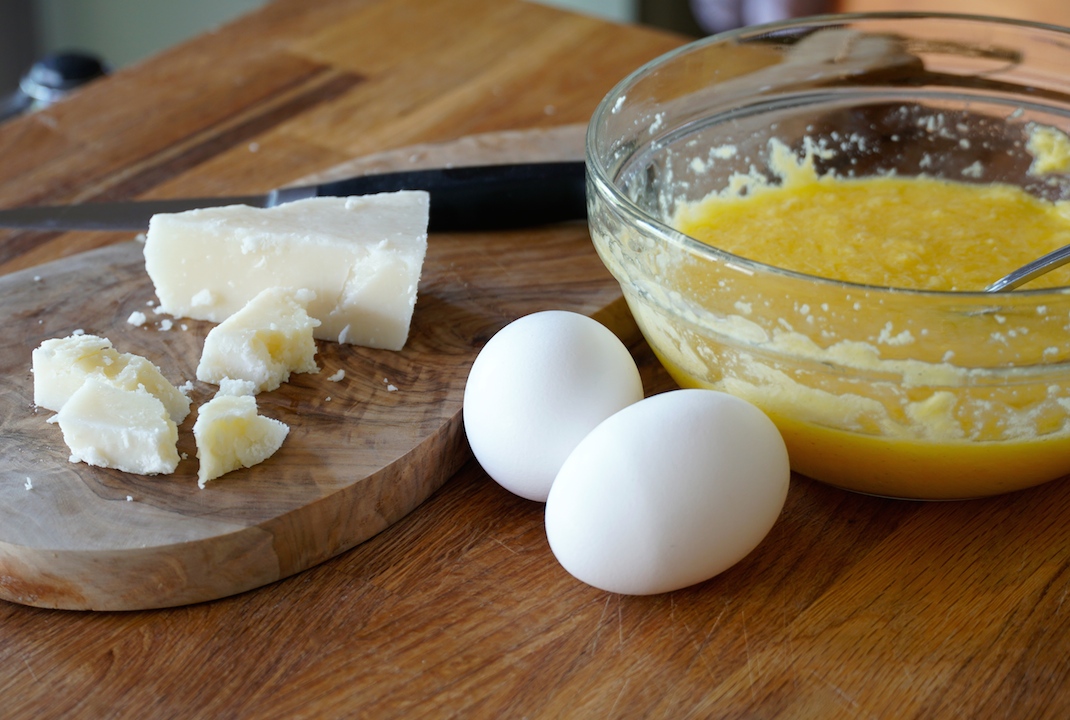 Eggs and pecorino ready to be added to the pot