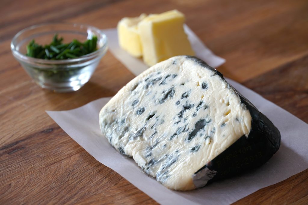 a big chunk of Saint Agur blue cheese