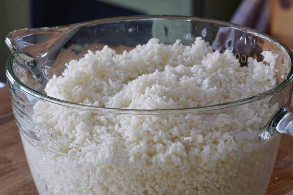 Raw cauliflower processed to resemble rice