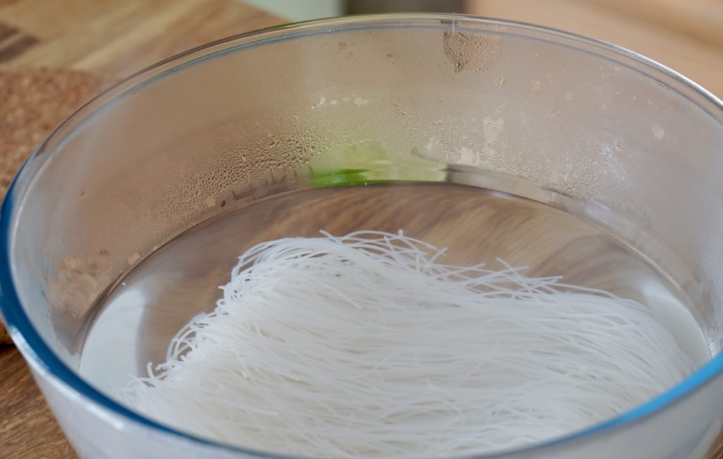 soaking the rice vermicelli in boiling water