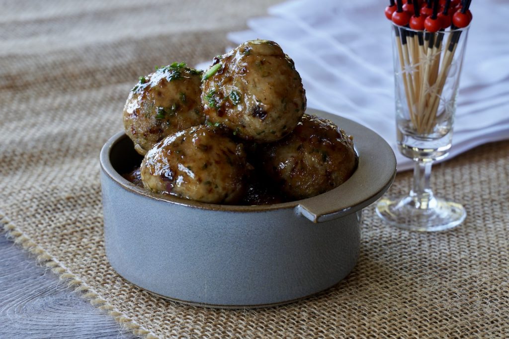 Serve Chicken Marbella Meatballs as a party snack