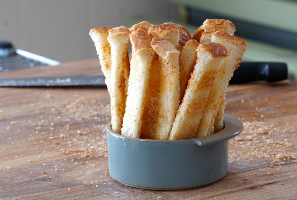 Toast soldiers are toasted white bread cut into thin strips, served as we have in an attractive bowl.
