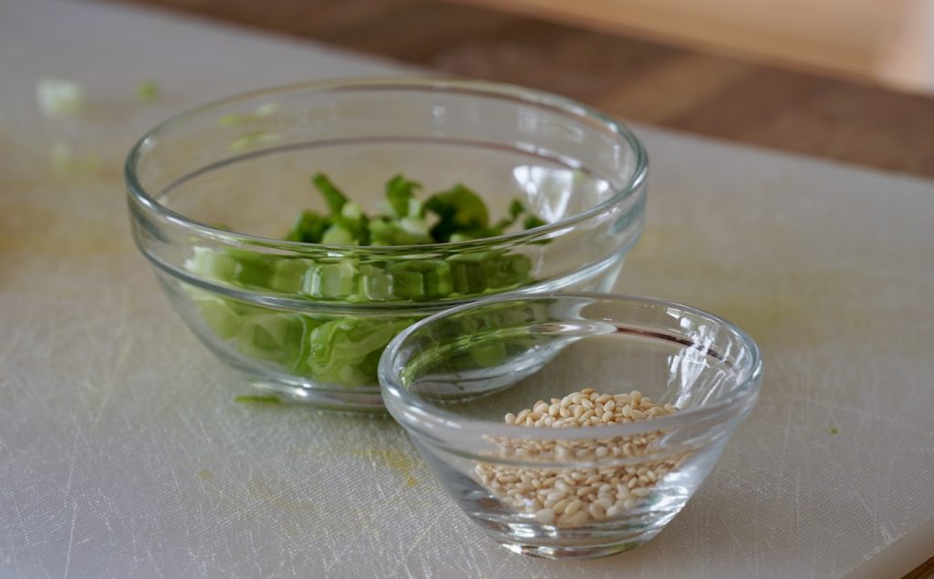 Chopped scallions and toasted sesame seeds