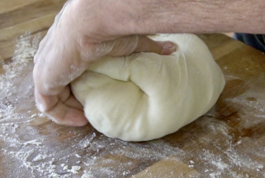 Folding the dough to create tension