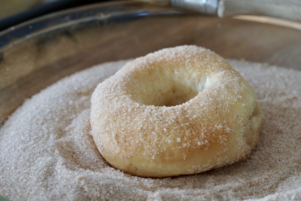 donuts rolled in the cinnamon sugar