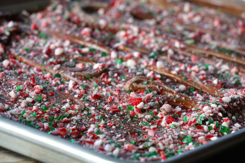 The chocolate smoothed out a sprinkled with crushed candy cane