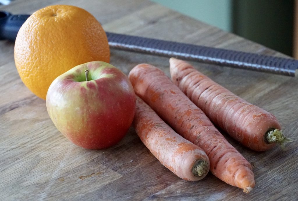 Carrots, an apple and orange zest