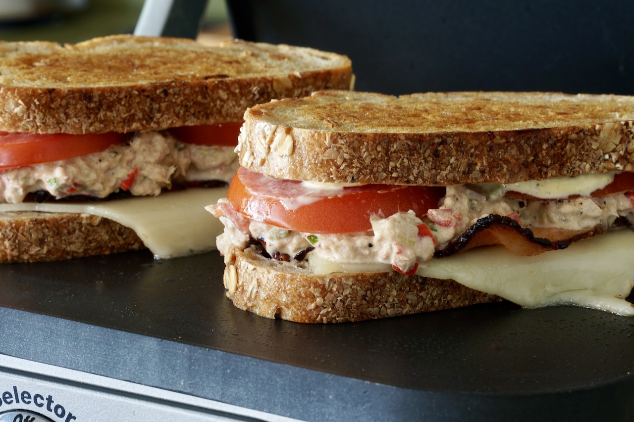 The tuna melts getting crispy on the sandwich press