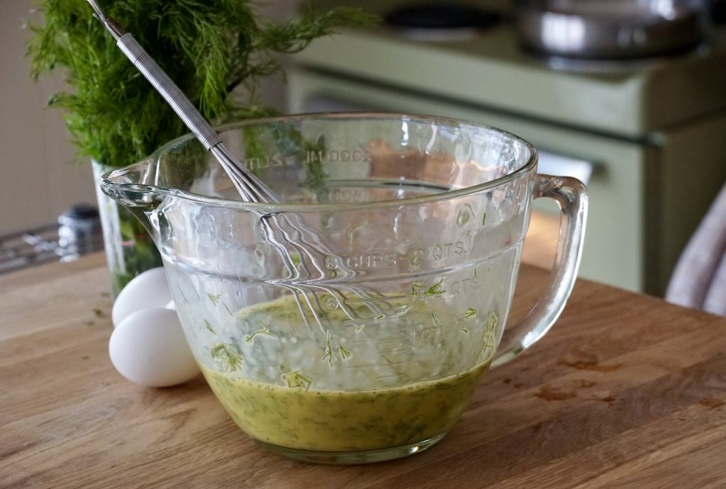 Eggs whisked together with fresh dill