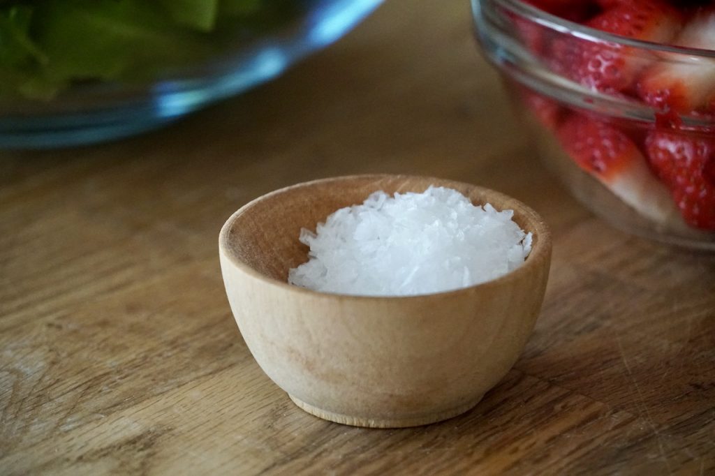 A tiny bowl with sea salt flakes