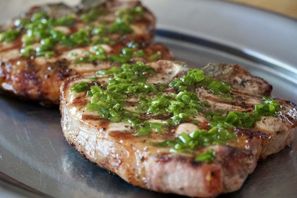 The pork chops with a drizzle of the lemon-chive vinaigrette