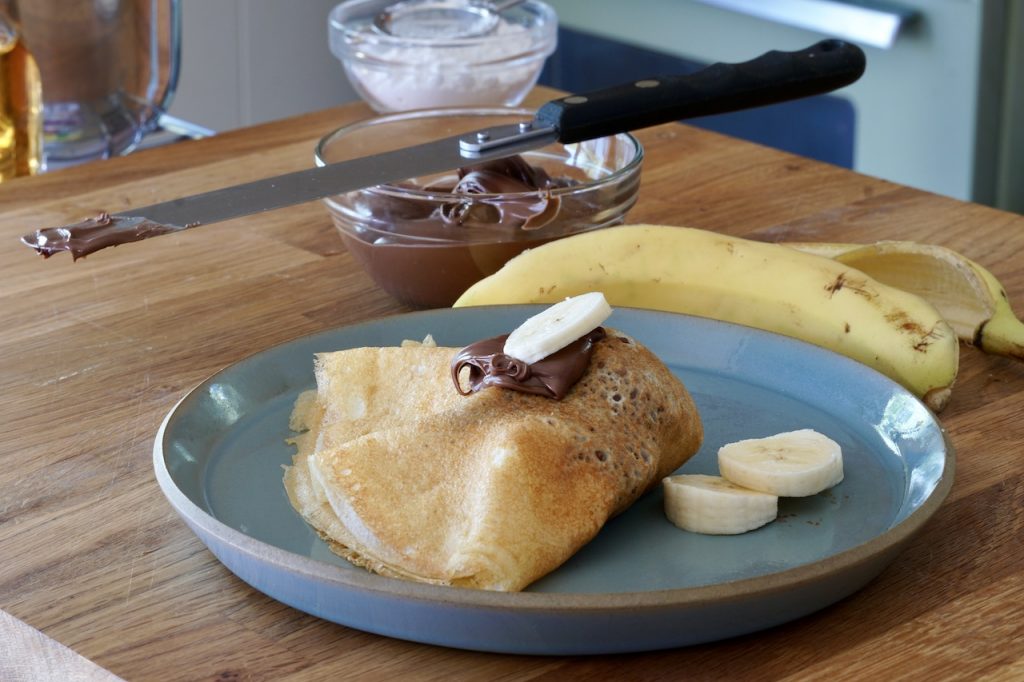 A pancake folded with Nutella and banana.