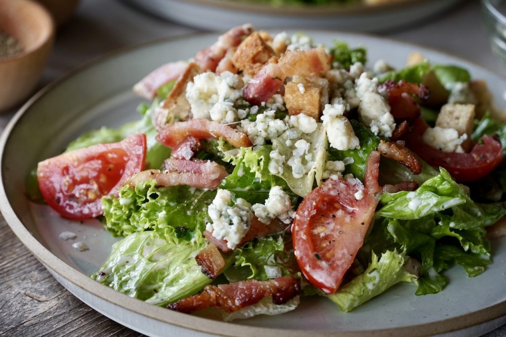 The BLT SALAD served with blue cheese, dressed with Creamy Buttermilk Ranch Dressing