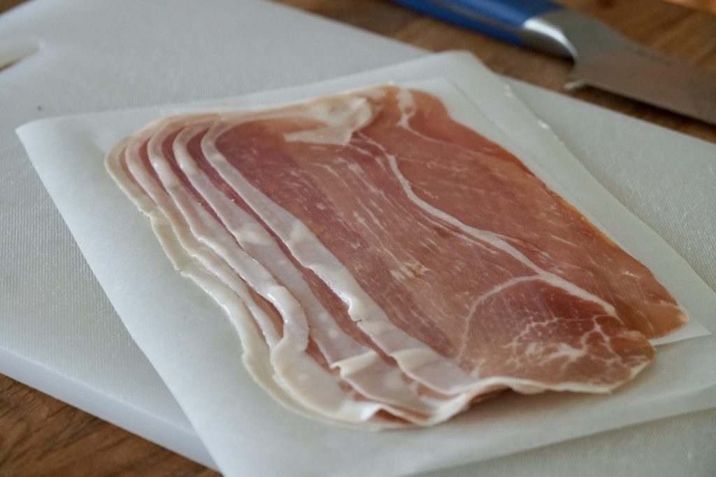 Thin slices of cured prosciutto