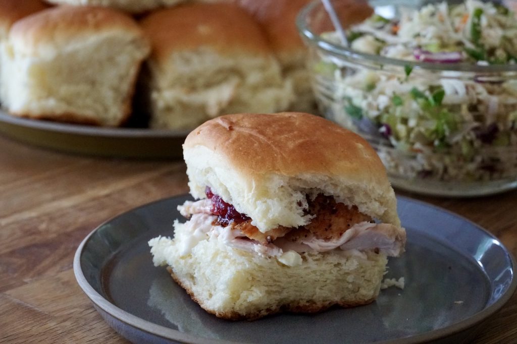 A roll filled with turkey and cranberry sauce