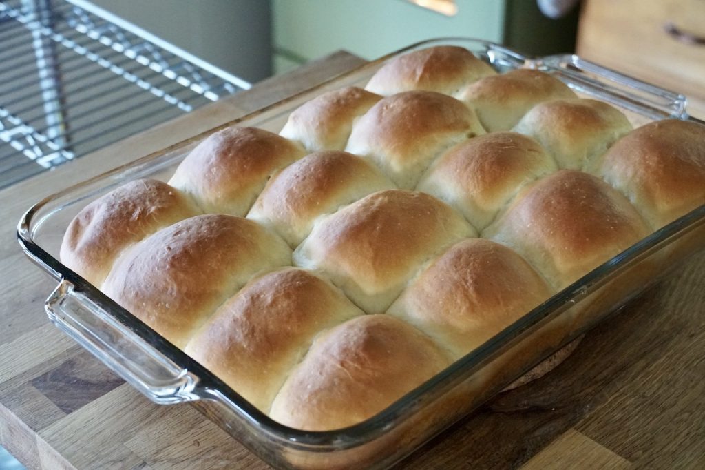 A batch of potato dinner rolls to be served with the pork