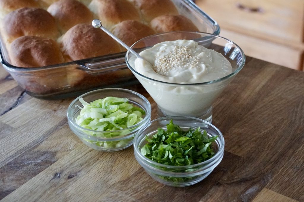 Garnishes include chopped green onions and cilantro plus our tangy honey-wasabi mayonnaise