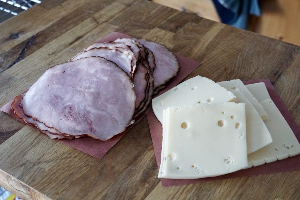 Thinly sliced ham and Swiss cheese