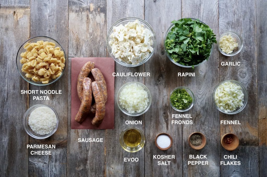 The ingredients for pasta with sausage, cauliflower and rapini