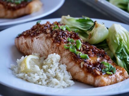 Easy Baked Asian Salmon Recipe served with bok choy and steamed rice.