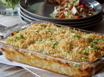 Easy Cheesy Potato Casserole Recipe served with a sprinkle of chopped green onions