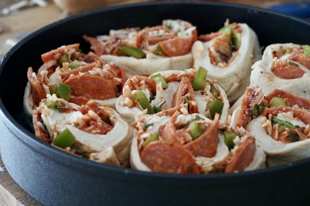 The roll is sliced into pinwheels that are then placed into the skillet