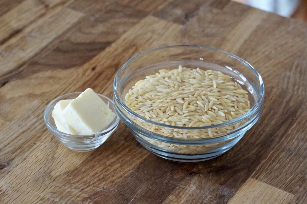 A bowl of small grain orzo pasta